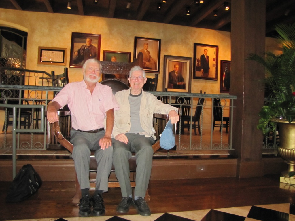 Greg Benford and David G. Hartwell sitting in President Taft's chair.