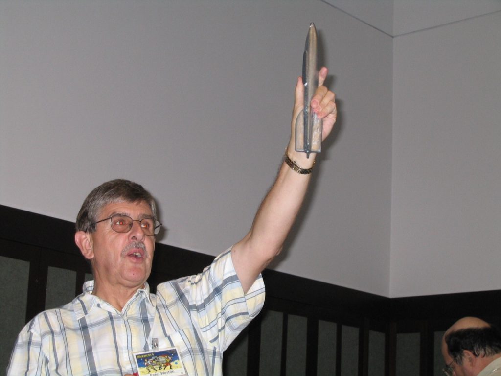 Peter Weston auctioning a Hugo rocket during Noreascon 4 (Boston), the 2004 Worldcon during which he was a Guest of Honor. Photo by Murray Moore.