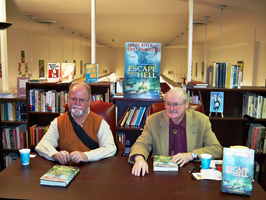 Larry Niven and Jerry Pournelle autographing Escape From Hell