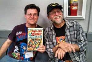 Len Wein with fan Robert Kerr holding a copy of X-men that his father bought him thirty years ago.
