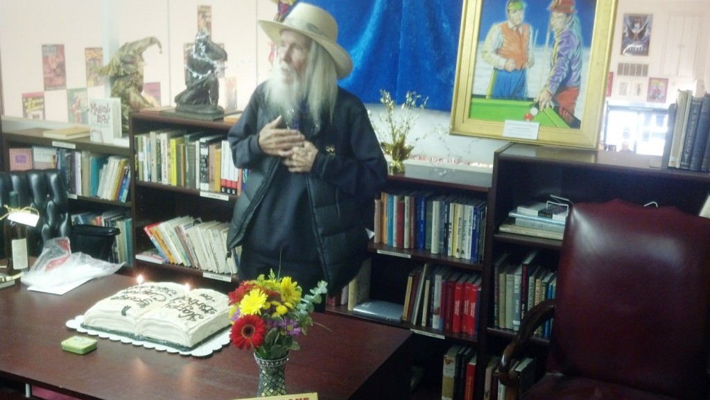 George pontificating instead of blowing out the candles. Photo by John King Tarpinian.