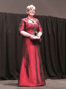 Ann Leckie receiving the Hugo Award in 2014. Photo by Henry Harel.