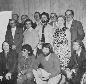 First meeting at the original LASFS clubhouse in 1973. Photo by Stan Burns. Back row, L to R:  Robert Bloch, Ray Bradbury, Jerry Pournelle, A. E. Van Vogt, Forry Ackerman. Middle row, L to R:  Unknown, Harlan Ellison, Larry Niven, Wendayne Ackerman  Front row, L to R:  Unknown, Bill Mills, Ron Cobb. 