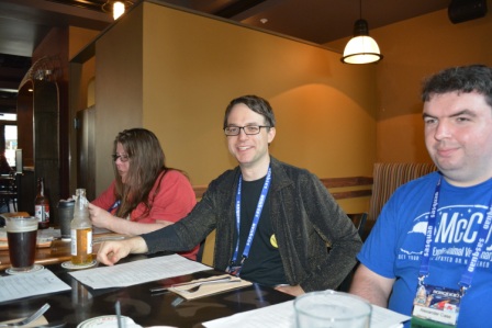 Greg Machlin, event organzier, center, Alexander Case, right, at File 770 Meetup in the Saranac. Photo by Francis Hamit,.