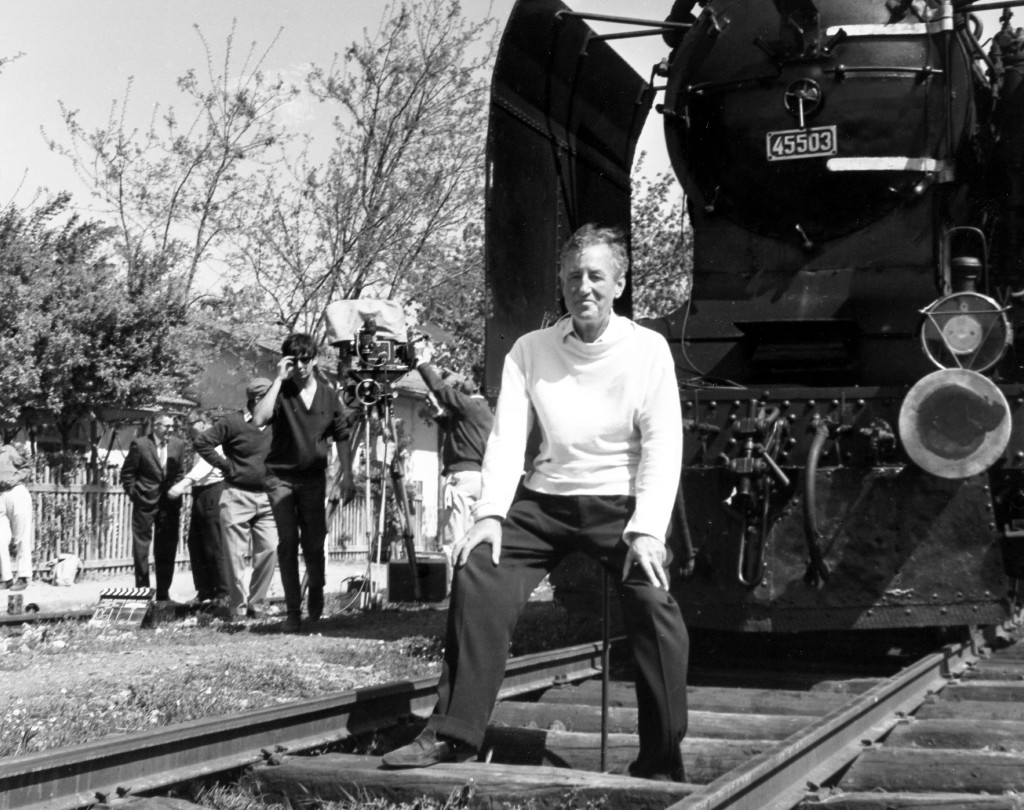 Ian Fleming, author of the James Bond spy thrillers, sits in front of a Turkish train, as a gag, during a visit to the set of the film "From Russia With Love" in 1963.
