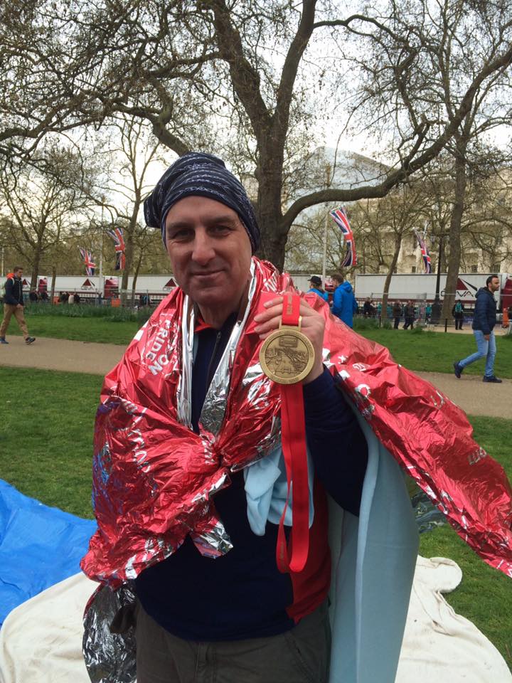 Jim Mowatt basks in the glory of a completed marathon.