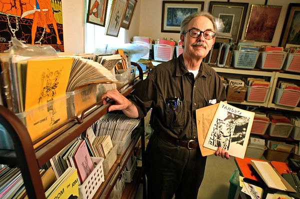 Ned Brooks with his fanzine collection. Photo from the Atlanta Journal-Constitution.