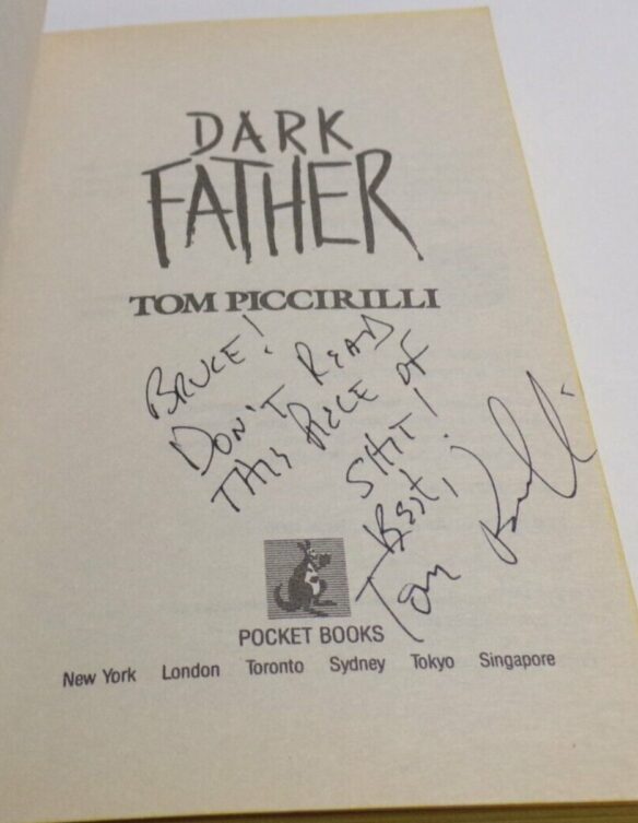 Title page of Dark Father by Tom Piccirilli. Autographed by author with inscription "Bruce! Don't read this piece of shit!"