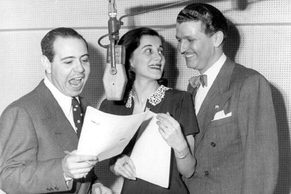 Black and white photo of Superman radio show cast members Jackson Beck (announcer), Joan Alexander (Lois Lane) and Bud Collyer (Superman)