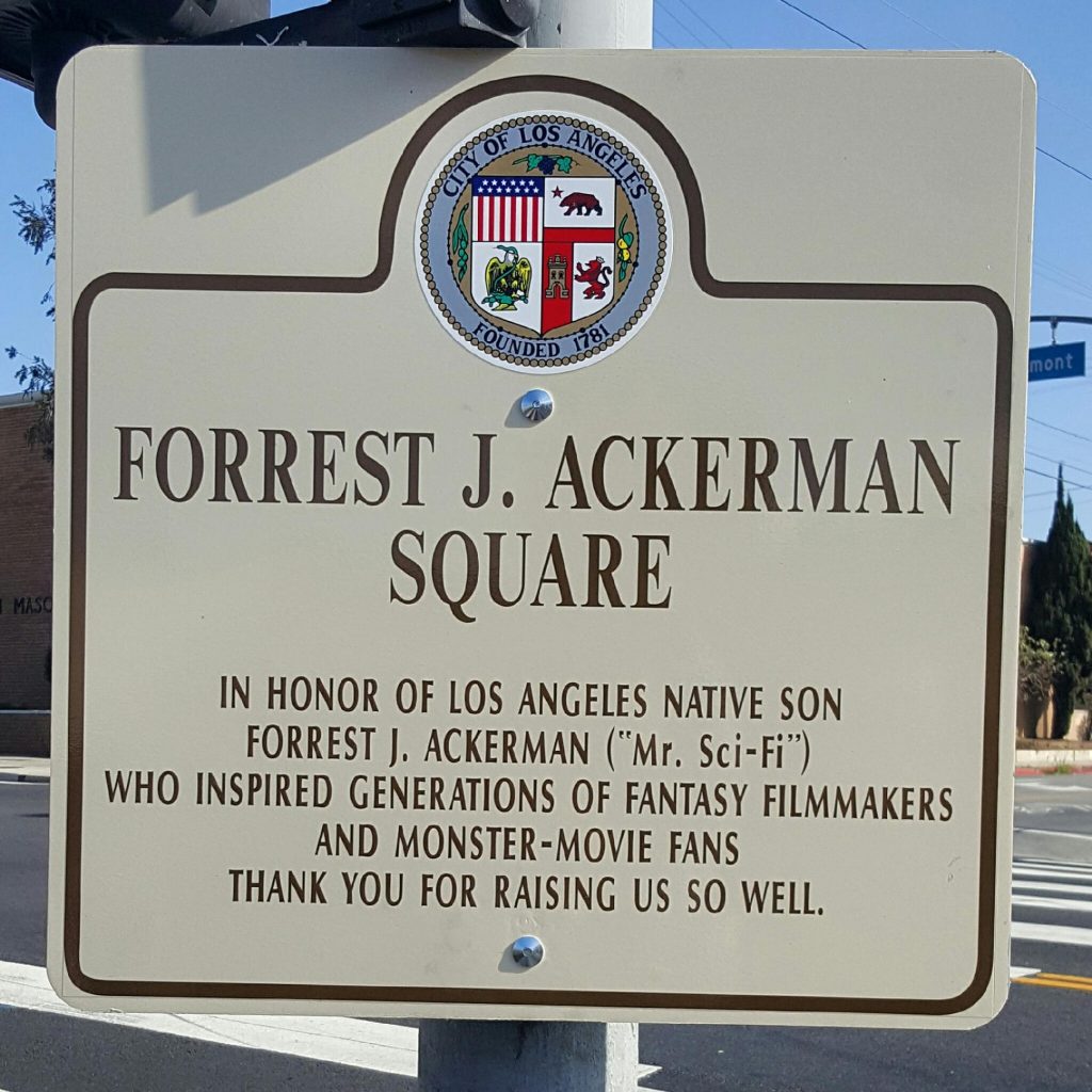 Ackerman Square dedication placard (with erroneous period after the initial "J"). 