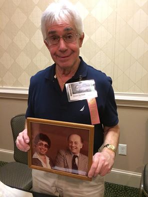 Steve Vertlieb displays photo of his younger self with Ray Harryhausen.